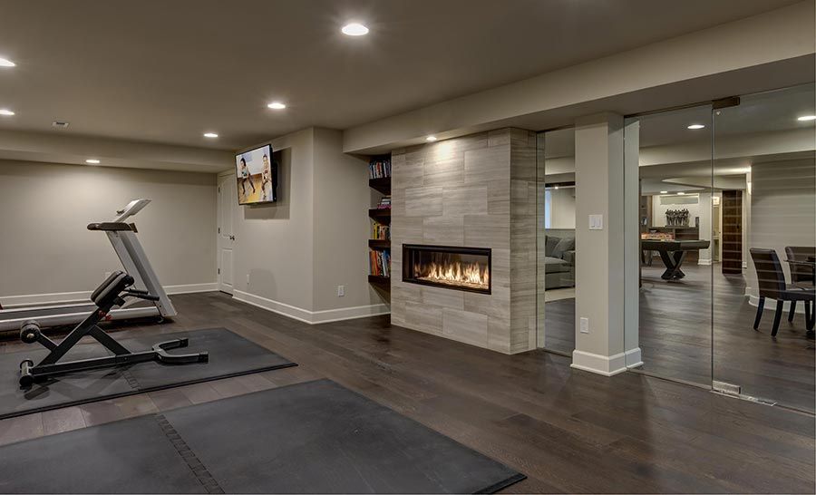 exercise-room-fireplace   Places You Never Thought of Putting a Fireplace 6